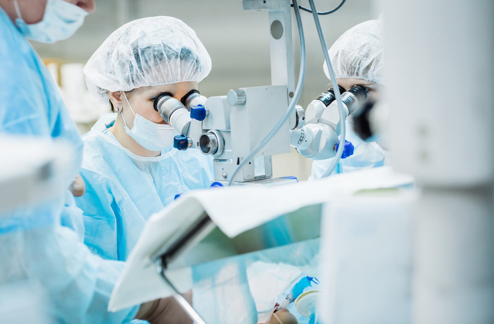 A surgeon performing laser eye surgery on a patient